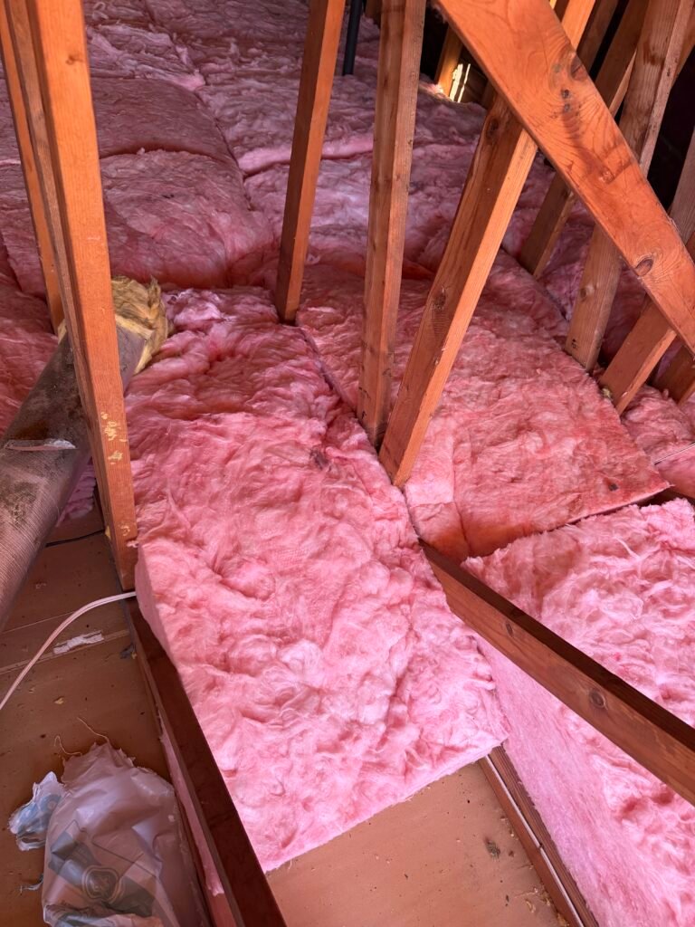 New pink fiberglass attic insulation installed by Atticity in the Bay Area, California